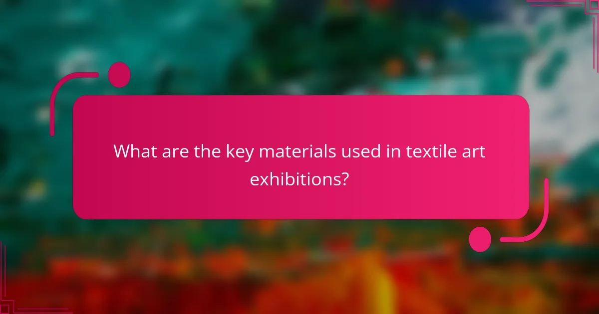 What are the key materials used in textile art exhibitions?